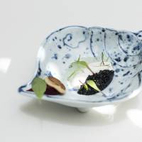 Fine dining paired with fine ceramics; feast to mark first anniversary; East meets West in natural setting