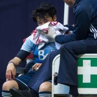 Vancouver Whitecaps striker Masato Kudo is driven off the field after breaking his jaw in a collision with Chicago Fire goalkeeper Matt Lampson on Wednesday. Whitecaps striker Kudo sidelined with broken jaw
