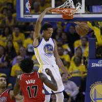 Golden State's Shaun Livingston dunks in front of Portland's Ed Davis in the first half of Game 5 on Wednesday night. The Warriors downed the Trail Blazers 125-121 to take the series 4-1. Splash Brothers lead way as Warriors finish off Blazers