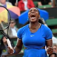 Serena Williams celebrates after winning a point during her match against Kristina Mladenovic during the third round of the French Open on Saturday in Paris. Williams won 6-4, 7-6 (12-10). Serena edges Mladenovic in third round