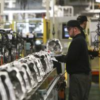 An employee works on an assembly line at the Nissan Motor Co. production plant in Sunderland, England, in 2013. Japanese firms in U.K. face uncertainty after Brexit vote