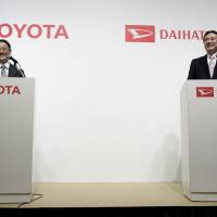Toyota Motor Corp. President Akio Toyoda (left) and Daihatsu Motor Co. President Masanori Mitsui attend a joint news conference in Tokyo in January. Daihatsu shareholders approve full ownership by Toyota
