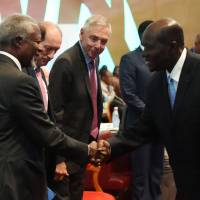 Nestle Chief Executive Officer Paul Bulcke (center) looks on as Ivorian Prime Minister Daniel Kablan Duncan (right) and former U.N. General Secretary Kofi Annan greet during the opening session of the Nestle Creating Shared Value Global Forum: Investing in sustainable development in Africa, in Abidjan on Tuesday. Nestle pledges internships, job training for 300,000 African youths