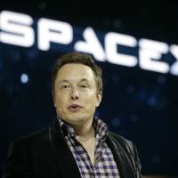 SpaceX CEO Elon Musk, shown in a file photo, said in an interview at tech news site Recode's Code Conference in Southern California on Wednesday that people will be on Mars in 2025. Tech moguls declare era of artificial intelligence