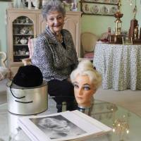 Retired hairstylist Margaret Vinci Heldt poses for a 2011 photo at her apartment in Elmhurst, Illnois. Heldt, who became a hairstyling industry celebrity after she created the famous beehive hairdo in 1960, has died at age 98. Ahlgrim Funeral Home said Monday that Heldt died Friday at a senior living community. Chicago-area 1960 creator of beehive hairdo dead at 98
