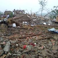 Damaged houses are seen after a tornado hit Funing county in Yancheng, Jiangsu province, China, on Thursday. 51 dead in extreme weather in eastern China: Xinhua