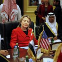 Then-U.S. Secretary of State Hillary Rodham Clinton talks to Gulf Cooperation Council Foreign Ministers during a meeting in Doha in January 2011. Mideast showed Hillary Clinton the limit of U.S. power