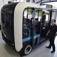 An electric, self-driving minibus Olli is seen Thursday at the Local Motors facility in National Harbor, Maryland. The vehicle is a partnership between Local Motors and IBM, using IBM's Watson supercomputer. Need a ride? Your local 3-D printer can build this minibus