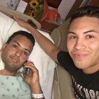 Felipe Marrero, 30 (left) poses in his hospital bed in Orlando, Florida, on Monday in this image taken by his friend Joseph Rivera, 34 (right). Orlando shooter played dead to elude police, was right next to me buying a drink: survivor
