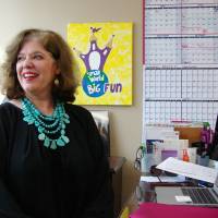 Cindy Minor sits at her desk at Small World Big Fun, a travel agency specializing in Disney vacations, in Little Rock, Arkansas, on Friday. Minor says she has not had any cancellations for trips to Orlando, Florida, despite a week of tragic headlines from the city, including a mass murder in a nightclub and a 2-year-old who died after being snatched by an alligator in a lake at a Disney resort. Orlando tourism unshaken by rare week of horrific news