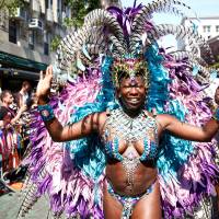 Participants take part in the annual NYC Pride parade in New York City Sunday. High security, Orlando tributes punctuate gay pride parades across U.S.