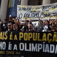 Civil police officers threatening to go on strike demonstrate against the government for arrears in their salary payments, in Rio de Janeiro Monday. Earlier this month, Rio state authorities declared a state of public calamity over a major budget crisis in order to release emergency funds to finance the Olympic Games due to begin in August. Rio police protest lack of pay, cruiser fuel, toilet paper as Olympics near
