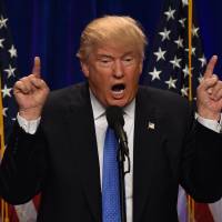 Donald Trump speaks at the Saint Andelm College New Hampshire Institute of Politics in Manchester on Monday. Trump adds new twist to immigration proposals, but legal doubts persist