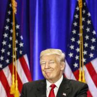 Presumptive Republican presidential nominee Donald Trump speaks at the Trump Soho Hotel in New York on Wednesday. Trump cools Muslim rants, rips into 'world-class liar' Clinton, blames her for Mideast mayhem