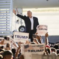 Republican presumptive presidential candidate Donald Trump arrives for a rally Wednesday in Sacramento. Trump University: Sales strategy foreshadowed campaign