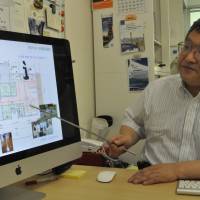 Eiichi Saito explains the nursing care robot project at Fujita Health University in Toyoake, Aichi Prefecture. Aichi university, Toyota in joint project for robot-aided seniors complex