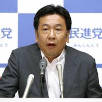 Democratic Party Secretary-General Yukio Edano speaks at a news conference in Tokyo on Friday. Edano denies pressuring Tepco over 'meltdown' use