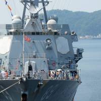 Local residents tour the guided missile destroyer USS Mustin during Yokosuka Friendship Day at the base in Kanagawa Prefecture last August. When it comes to offences by troops, victims often come up against a wall of legal protections. Family's pain over 2006 Yokosuka murder reflects desire for SOFA rethink