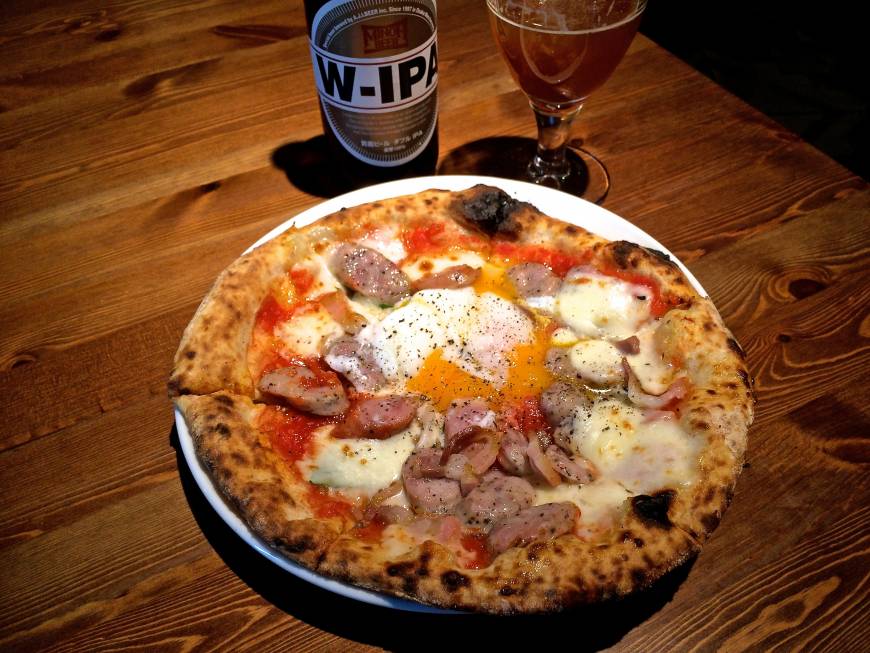 Pizzeria Bakka M’unica Naples-trained: One of Hazama’s most popular offerings is his sausage and soft-cooked egg pizza. | ROBBIE SWINNERTON