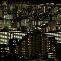 Unassisted in the city: Residential buildings stand illuminated at night in Tokyo. An increasing number of Japanese people aged over 65 are living alone and falling into poverty, making it difficult for them to find a person who will guarantee to pay their rent if they cannot — something required by landlords in Japan. No guarantees: the struggle of being old and alone in Japan