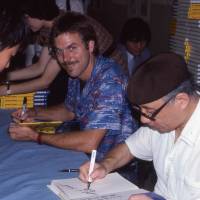 Frederik L. Schodt and Osamu Tezuka sign “Manga! Manga!: The World of Japanese Comics” in Tokyo, 1983. Drawing on the past of Osamu Tezuka