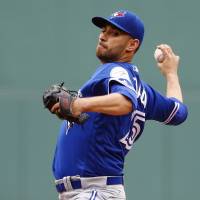 Toronto's Marco Estrada delivers during the Blue Jays' 5-4 win over the Red Sox at Fenway Park on Sunday. Toronto's Estrada takes no-hitter into eighth