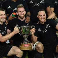 New Zealand captain Kieran Read (center) poses with teammates Israel Dagg (right) and Ben Smith after their victory over Wales on Saturday in Wellington. All Blacks too much for Wales