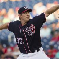 Washington's Stephen Strasburg throws a pitch against Philadelphia in the first inning on Friday night. Strasburg raises record to 10-0