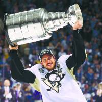 Pittsburgh's Sidney Crosby hoists the Stanley Cup on Sunday night after the Penguins beat the San Jose Sharks 3-1 in Game 6 to take the series 4-2. Crosby also won the Conn Smythe trophy as the playoff MVP. Penguins hold off Sharks in Game 6, capture fourth Stanley Cup