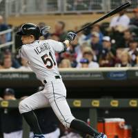 Miami's Ichiro Suzuki hits a single in the first inning of the Marlins' 6-4 loss to the Twins on Tuesday. Ichiro moves closer to Rose's iconic mark