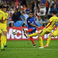 France's Dimitri Payet (center) scores against Romania in the opening game of Euro 2016 on Friday night at Stade de France. France edges Romania on Payet's goal in opener