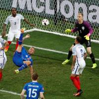Iceland's Ragnar Sigurdsson tries an overhead kick against England in Euro 2016 on Monday in Nice, France. Iceland won 2-1. Iceland scores epic victory over England in shocker