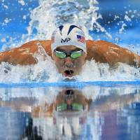 Michael Phelps swims in the 200-meter butterfly final at the U.S. Olympic trials in Omaha, Nebraska, on Wednesday. Phelps won the race in 1 minute, 54.84 seconds. Phelps wins 200m butterfly, makes fifth Olympic team