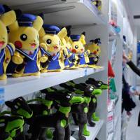 Pikachu plush toys are displayed for sale at the Pokemon Center Mega Tokyo store in Tokyo in February. Nintendo's 'Pokemon Go' hit gives early taste of smartphone success
