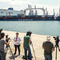 Journalists and reporters gather at the Israeli southern port of Ashdod as the Lady Leyla, a humanitarian aid ship sent from Turkey to the Gaza Strip, arrives to the port on Sunday. Turkish ship brings Gaza-bound aid to Israeli port after reconcilation deal