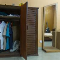 A guitar stands on a bed and clothing hangs in the wardrobe of Mir Saameh Mubasheer at his family home in Dhaka on July 4. Bangladesh says 261 officially missing amid radicalization fears