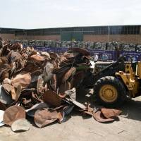 Piled up satellite dishes and receivers being destroyed Sunday during a ceremony in Tehran. Iran destroyed 100,000 satellite dishes and receivers as part of a widespread crackdown against the illegal devices that authorities say are morally damaging, a news website reported. Guard-linked militia destroys 100,000 satellite dishes across Iran