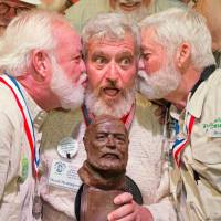 Dave Hemingway receives smooches from Charlie Boise (left) and Wally Collins after winning the 2016 Ernest Papa Hemingway Look-Alike Contest in Key West, Florida, Saturday. And the Sloppy Joe's look-alike contest winner: Dave Hemingway (no kin)