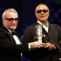 Iranian director Abbas Kiarostami (right) receives an award from U.S. director Martin Scorsese during the closing ceremony of the 5th Marrakesh International Film Festival in Marrakesh, Morocco, Nov.19, 2005. Acclaimed Iranian filmmaker Kiarostami dies in France at 76
