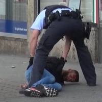 In this grab taken from video, police arrest a man in Reutilingen, Germany, Sunday. A Syrian man killed a woman with a machete and wounded two others Sunday outside a bus station in the southwestern German city of Reutlingen before being arrested. Police said there were no indications pointing to terrorism. Terrorism ruled out as asylum seeker kills woman in Germany with machete