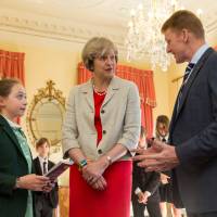 British astronaut Tim Peake visits Downing St. to meet British Prime Minister Theresa May and students for a reception in London Monday. Britain's new prime minister urges Parliament to vote to renew nuclear sub fleet, keep deterrence