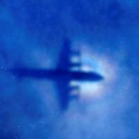 The shadow of a Royal New Zealand Air Force (RNZAF) P3 Orion maritime search aircraft can be seen on low-level clouds as it flies over the southern Indian Ocean looking for missing Malaysian Airlines flight MH370 on March 31, 2014. Computer modeling puts MH370's possible sea floor grave 500 km farther north