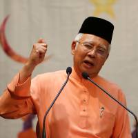 Malaysian Prime Minister Najib Razak speaks at an event in Kuala Lumpur on July 21. Malaysia's Najib gets new powers to quell dissent amid planned protests over fund scandal