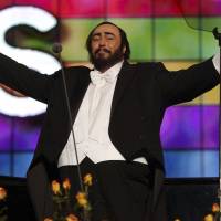 Luciano Pavarotti bows to the audience during the Pavarotti & Friends charity concert for Iraqi children at the Novi Sad Park in Modena, Italy, on May 27, 2003. A newspaper in the Italian town where Pavarotti lived says the late tenor’s loved ones don’t want the Trump campaign to play one of his signature arias, “Nessun Dorma.” Pavarotti's family slams Trump's use of famed aria, candidate's world view