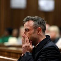 Oscar Pistorius reacts during the third day of his resentencing hearing for the 2013 murder of his girlfriend Reeva Steenkamp, in the North Gauteng High Court in Pretoria, South Africa, on June 15. Prosecutors seek longer Pistorius sentence