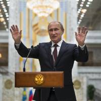 Russian President Vladimir Putin speaks to the media after talks in Minsk in this August 2014 file photo. Russia has said it was not involved in the hacking of the Democratic Party email system, but experts say Russia had motive, capability and form. Russia has motive, capability for U.S. email hack but players remain unclear