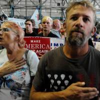 Supporters of Republican presidential candidate Donald Trump recite the Pledge of Allegiance at a campaign event in Denver on Friday. Presidential hopefuls Trump, Clinton spar in bid to get upper hand on national security