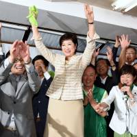 Former Diet lawmaker Yuriko Koike cheers after the results of the Tokyo gubernatorial election are announced on Sunday evening. Former environment minister Yuriko Koike wins landslide election as Tokyo's first female governor