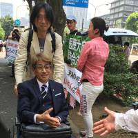 Advanced liver cancer patient Masamitsu Yamamoto is greeted by supporters on July 12 as he shows up at his trial over possession of marijuana at the Tokyo District Court. Medical marijuana advocate dies of cancer while on trial
