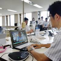 Consumer Affairs Agency staff work at their temporary office in the Tokushima Prefectural Government building Monday as part of trial operations for a permanent move from Tokyo. Consumer Affairs Agency tests the water for moving HQ to Tokushima